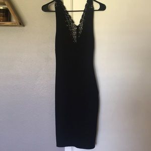 Bebe tight black knee length dress with lace back